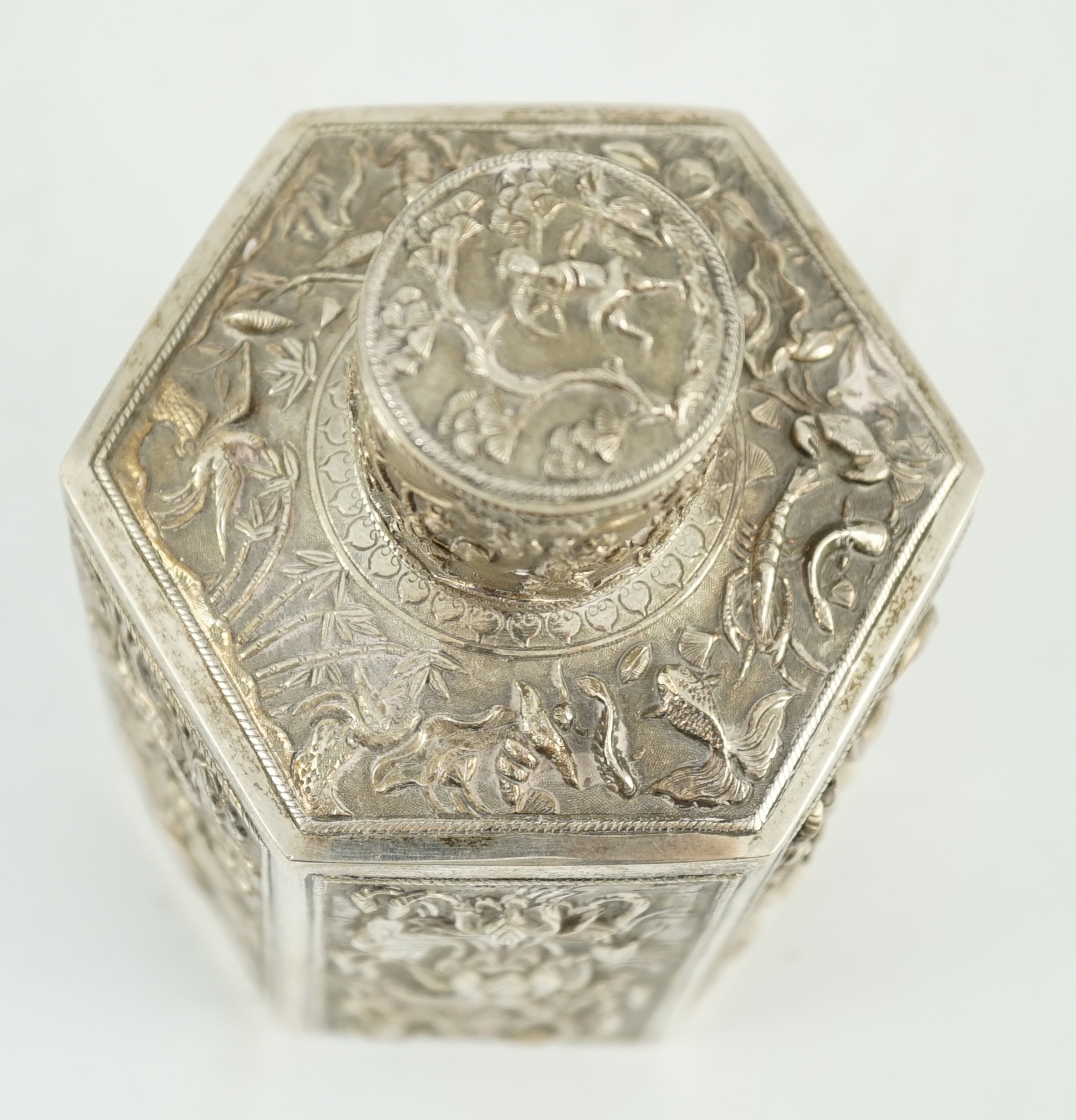 A late 19th century Chinese Export silver hexagonal tea caddy and cover, by Cumwo